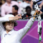 The Ki Bo Bae Effect Bow takes a closer look at South Korea’s greatest In April, recurve archery fans were thrilled to see the return of “the recurve queen” to the Korean squad of 2023. Multiple Olympic champion Ki Bo Bae last appeared on the international circuit in 2017, when she earned her final World Cup gold in Rome, the third of her career. Since then, she is said to have been thinking of retiring, at least as an athlete. What will the veteran 35-year-old do now - and how is she perceived in her own country? Rise to Fame Like many Korean children, Ki Bo Bae started archery as an extracurricular activity in middle school, around the age of twelve, with little thought of becoming a professional athlete. But her teacher brought her talent to her parents’ attention and suggested she should compete. By the end of middle school Ki had won three gold medals in one of country’s most important national youth sports festivals and was selected as a junior representative. This kickstarted her career. The gold medal sweep continued with her winning the team gold at the Junior World Championship of 2004 at Lilleshall. Around this time her school grades began to suffer, and it was said that her parents were thinking of discouraging her from pursuing the sport. However, Ki Bo Bae pressed on, collecting gold after gold in individual and team events at the World University Games, the Asian championships, and World Cups. This culminated in her becoming the double Olympic Champion at the 2012 London Olympics. It seemed that wherever she went, particularly in the solo exhibitions, the gold was hers – “The Ki Bo Bae Effect”. There is no doubt that if there had been a mixed team event at that time, she would have taken that too. This image has an empty alt attribute; its file name is Ki_Bo_Bae_London-2012-Olympic-Games_World-Archery-Archive-1024x684.png London 2012, Olympic Games. World Archery Archive National Pride and its rewards In South Korea, unlike some other countries, archery is a source of national pride, handsomely rewarded both by the government and private business. Following the Korean War of 1950-1953, and the division of the country, the South remained a military dictatorship until 1980. However, with the installation of a new president came new policies and an influx of wealth and resources, and the divided nations diverted their rivalry to sport. South Korea focussed on developing new generations of athletes from the ground up. In schools, the boys were encouraged to practice taekwondo, the girls archery. Since then, both government and business, the Hyundai Group at the helm, have acted as patrons of the sport, generously and strategically investing in the infrastructure and the development of archery, and offering handsome rewards for medals earned on international podiums. For example, for winning an Olympic gold medal in archery, in addition to other big monetary prizes, an archer will also receive a lifetime monthly pension of 1 million Korean Won (around £600). Both silver and bronze podiums are also rewarded. The Korea Times reported that, for Rio 2016, the Korea Archery Association rewarded each individual gold medallist with an equivalent of £120,000 and around £90,000 was paid out to each team member for winning the team gold. With extra pressure on the unbeaten Korean women, the KAA is set to raise its pay-outs even higher for the Paris Games. Such rewards for success are, unsurprisingly, a further incentive for many professional athletes. Ki Bo Bae has earned a total of four Olympic medals: two gold, one individual, one team event at London in 2012; and one team gold and an individual bronze at Rio in 2016. For each gold she will receive a lifetime pension. But this of course does not mean she should retire. Not good enough? A year ago, during her interview with World Archery, Ki Bo Bae spoke of gaining a lot of fans following her brilliant win in London. She received one of the highest forms of honour for a sportsperson following her achievements; the International Archery Centre at Gwangju, the capital of archery in Korea, a range used for the second stage of the 2022 Hyundai Archery World Cup, was named after her. On the one hand, this signifies the importance of her achievement as an individual archer at the Olympic Games. On the other, it confirms her celebrity status in the country. However, the fact that it took ten years for her to receive full recognition for her 2012 achievements begs the question, why? The issue was raised in the WA’s article, that despite the massive international and domestic fanbase, Ki was not as celebrated as the other successful women in the Olympic lineage, Kim Soo Nyung (52) and Park Sung Hyun (40). Like Ki, both women, in addition to other Olympic podiums, also took one individual and two team golds at the Olympics in their careers. It is hard to judge why she was not considered their equal. It is difficult for an outsider to pin down the reason that there seemed to be a feeling that she somehow wasn’t “good enough”. It seems that Ki might have drawn the short straw as, compared to her predecessors, her success occurred in an era of social media, where information travels fast and speculation is rife. One need look no further than the 2020 Games, where there was public outrage fed by the anti-feminist groups because An San, the triple gold Tokyo 2020 medallist, had worn her hair cut short! Today, there seem to be two different standards by which the Korean archers are measured, one based on international success, another on domestic, the second of which Ki was perceived not to have achieved following her massive international wins. Reportedly, Ki’s failure to top the charts in the national preliminaries, and the subsequent malicious public criticism, left her devastated, demonstrating the level of pressure and scrutiny to which these athletes are subjected. The London Olympics of 2012 was the first time the tie break was introduced. The gold medal event culminated in a one arrow shoot off against Mexico's Aida Roman. Both Ki and Roman shot 8s - Ki a high 8, Aida a wide left. Ki walked away with the medal but was also shamed by her countrymen for not finishing it in the "Korean" style - inside the gold. An influential celebrity commented that she had been “lucky to win it”! It did bring her down, and it did feel as though she was still somewhat hung up, "ashamed" even, for not having shot a "good score" in the tie break - as she said to WA in 2022. It is part of the South Korean mentality, which demands nothing less than perfection in its heroes and heroines. Out of the slump Narratives do change, and a gold claimed for the nation is still a gold. Domestic commentators now speak favourably, and the media describe Ki Bo Bae as a natural team leader, and are proud of listing her many wins and successes starting from her school years: “She appeared like a comet in 2010 and earned the title of monster rookie”. However, the pressure is on for the Korean women: to date, the women’s team remains unbeaten, winning their ninth consecutive team gold at Tokyo in 2020. Winning a tenth in Paris 2024 would be a national triumph. Aside from using Ki Bo Bae to inspire and boost the morale of those who will be shooting in Paris, one of her biggest contributions to archery, a point that is usually dismissed, is that she brought the individual gold back to Korea after a brief interruption in the gallery of South Korean medals. The individual gold medal streak starting from the LA 1984 Games was interrupted by Team China at Beijing 2008. What Ki Bo Bae did was more than win ‘just another gold’ - she lifted the Koreans out of the ‘uncharacteristic slump’, and with it, their morale. Though she did not win another individual gold at Rio in 2016, she took gold in the team event. Following her final international podium in 2017, Ki Bo Bae married and had a daughter. Apart from attending to her education - a Masters, followed by a PhD in physical education - Ki began to work as an Olympic commentator, speaking proudly of the women from her alma mater Gwangju Women’s University, including Choi Mi Sun and An San. This image has an empty alt attribute; its file name is Podium_Ki_Bo_Bae-1024x682.png Final podium at London 2012, Aida Roman on the left “… she lifted the Koreans out of the ‘uncharacteristic slump’, and with it, their morale.” Next Chapter Later in the WA interview Ki spoke of her interest in developing an elementary school archery programme for children, alluding to retirement, only to reappear, much to everyone’s surprise, at the following year’s national trials. “When I think of the Paris Olympics, it gives me headache”, said Ki to WA, referring to the amount of hard work it takes to make the team. She qualified overall eighth in the notoriously arduous national trials at Gwangju, finishing out of the top four. This means that she will remain on the squad but will not be representing Korea internationally - though this is not entirely off the cards. This image has an empty alt attribute; its file name is Ki_Bo_Bae_Professional-1-1024x828.png Meet professor Ki! (Seoul National University) Finding current information on Korean athletes can be problematic; there are few reliable sources. South Korean mainstream media reports are often hearsay. Successful South Korean sporting athletes are treated like celebrities; through their sporting achievements they attain a certain social status. Korean society is still largely hierarchical – social standing and achievement matter very much. Moreover, despite the obsession with social media and K-culture, many famous people in South Korea tend to be secretive about their personal lives. Not everyone wants the world to know what they have had for breakfast. However, on March 3rd this year, Ki Bo Bae was speaking about her plan for an archery course to a group of students at Seoul National University. From there the rumour has spread that she would be appointed lecturer for the Liberal Arts “Archery” class for university freshmen. Many messages and screenshots appeared claiming a leaked teaching file bore her name. Messages read:” Ki Bo Bae is world class”, “Professor Ki Bo-bae's archery is showing a 10:1 competition rate” and so on. The university did not officially confirm the tutor for the module; however, the entry rate for the class speaks volumes of the “Ki Bo Bae effect” – both 9am and 11am lectures exceeded 300 entrants as against a normal class size of 30. Either way, Ki Bo Bae is here to stay.